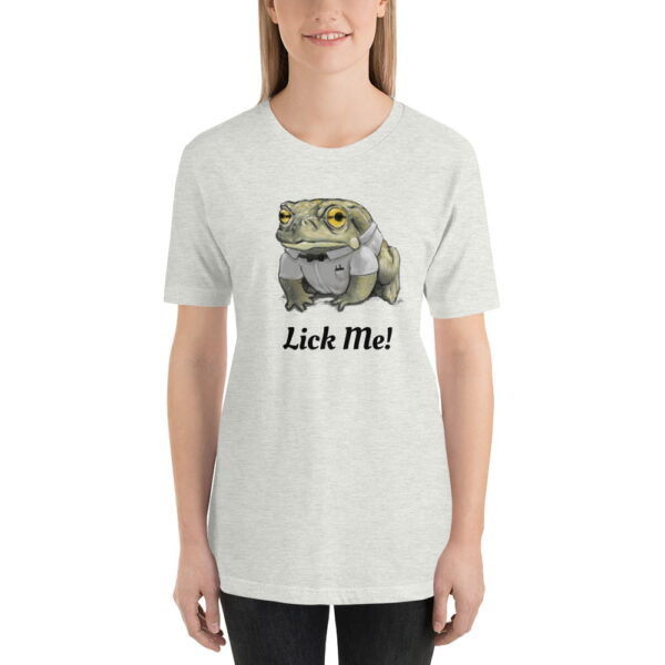 a woman wearing a white short sleeve toad t-shirt with the word lick me on it