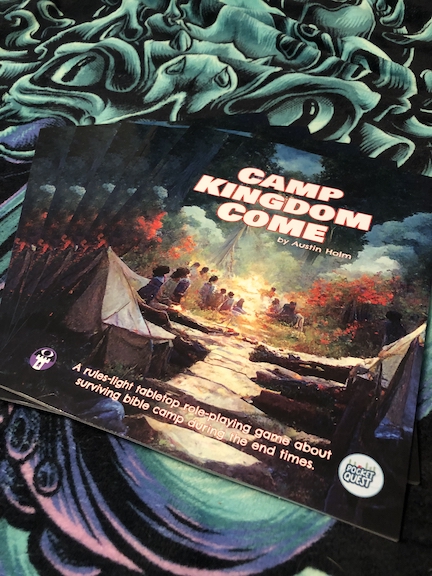 Photo of Camp Kingdom Come print-on-demand book. A lovely color image of campers surrounding a lit forest scene.